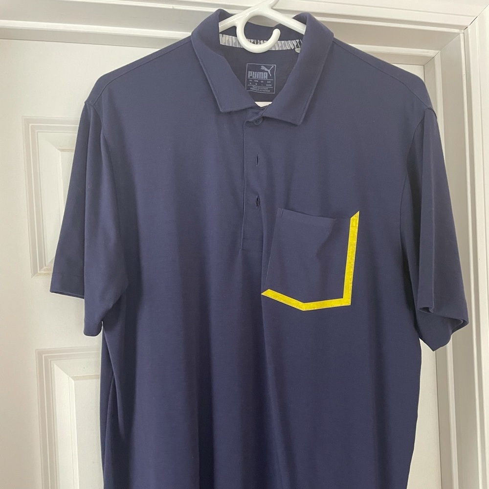 Puma golf shirt. Navy size medium. Good condition.